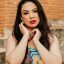 Colorful portrait of a woman with vibrant dress in São Paulo, Brazil.